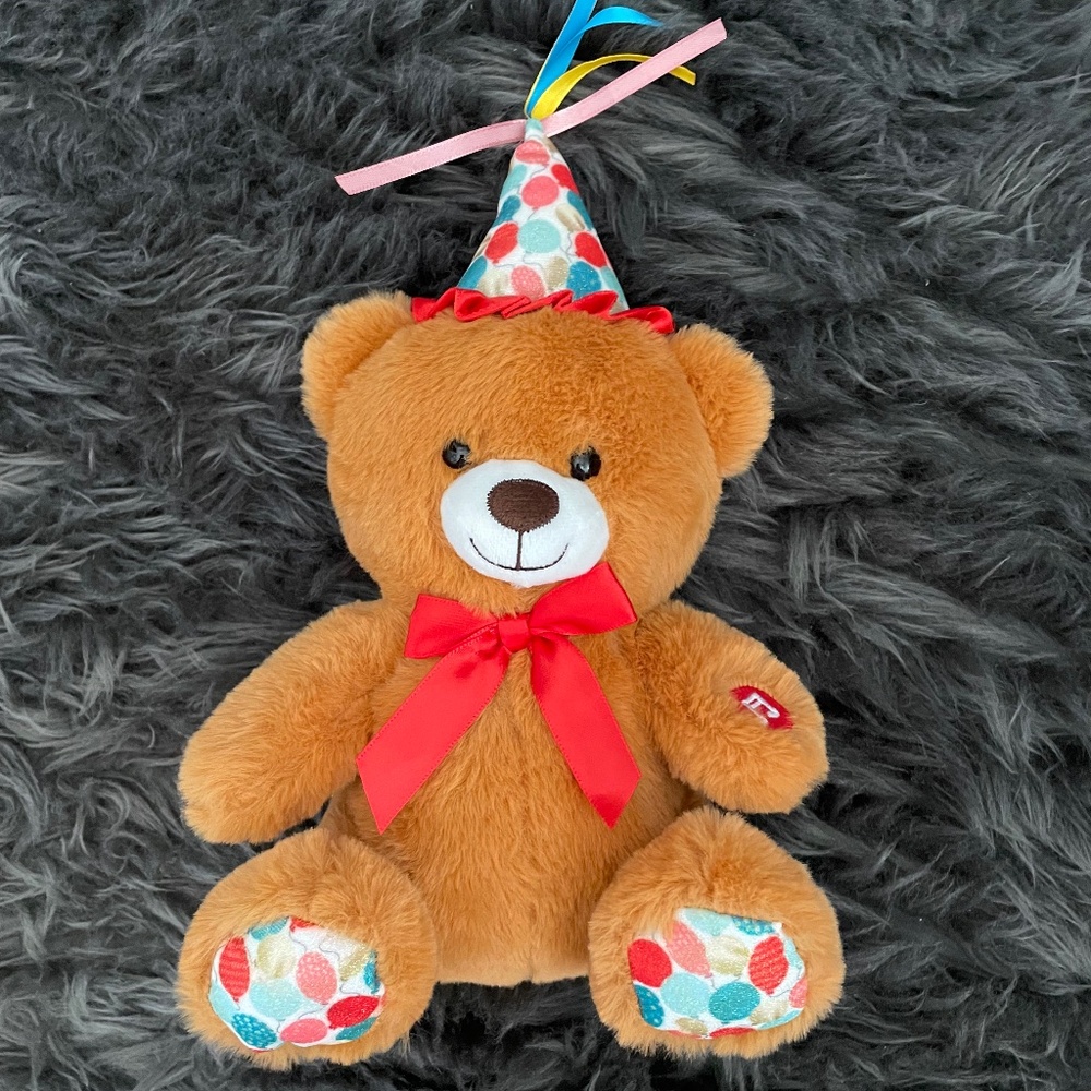 Birthday singing stuffed toy teddy bear